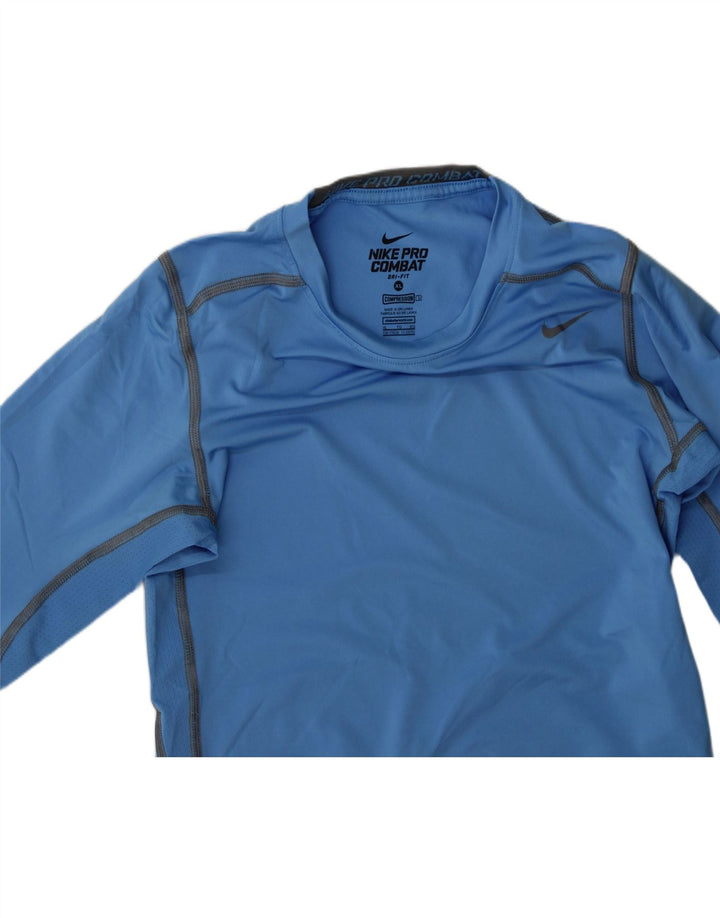 NIKE Boys Dri Fit Top Long Sleeve 13-14 Years XL Blue Polyester Vintage Nike and Second-Hand Nike from Messina Hembry 