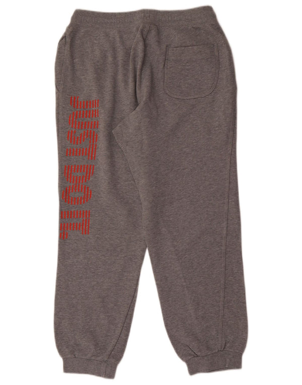Pantalon de survêtement graphique Nike Homme Pantalon de jogging en coton gris moyen