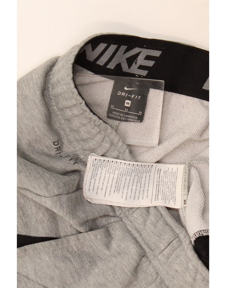Męskie spodnie dresowe NIKE Dri Fit, średnioszare, poliestrowe