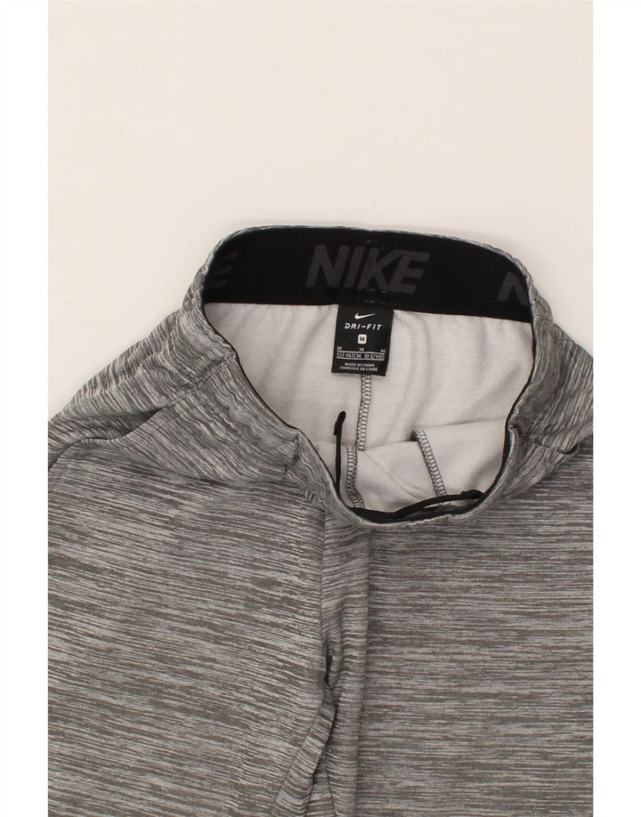 NIKE Boys Dri Fit Graphic Tracksuit Trousers 10-11 Years Medium Grey Vintage Nike and Second-Hand Nike from Messina Hembry 