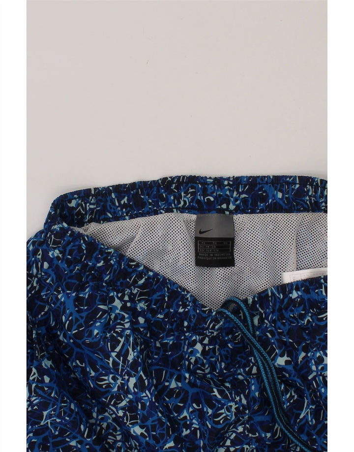 NIKE Boys Abstract Pattern Sport Shorts 15-16 Years XL Blue Polyester Vintage Nike and Second-Hand Nike from Messina Hembry 