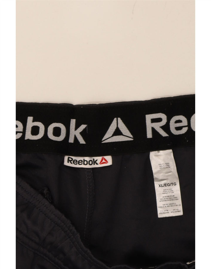 REEBOK Mens Tracksuit Trousers XL  Black Colourblock Polyester Vintage Reebok and Second-Hand Reebok from Messina Hembry 
